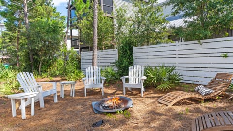 Backyard fire pit with seating for gatherings.