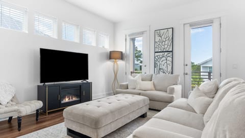 Bright, stylish living room with ample seating and natural light.