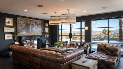 Resort sized pool surrounded by loungers and desert scenery.