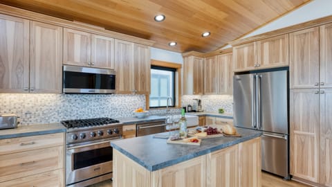 An open-concept living area seamlessly connects the kitchen, dining, and relaxation spaces.