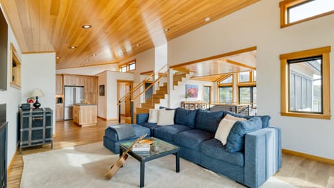 Enjoy movies by the fireplace in the living room, or gather on the deep sectional after dinner.