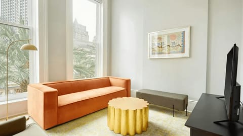 Spacious living room with comfortable seating and a TV.