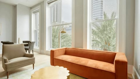 Spacious living room with comfortable seating and a TV.