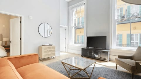 Living room with plush seating and a TV.