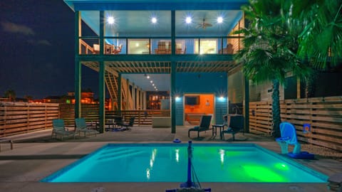 Rear view of the house with private pool and upper deck.