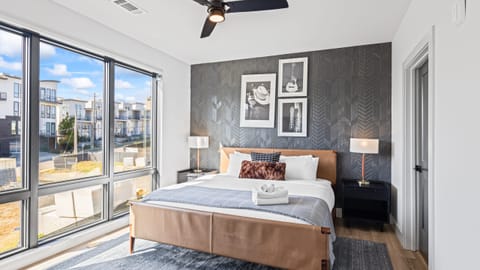 The primary bedroom features a king bed, TV and an ensuite bathroom.