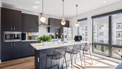 Relax at the kitchen counter with barstool seating.