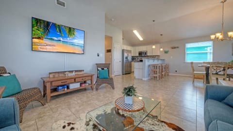 Open concept living area with comfy seating and a TV.