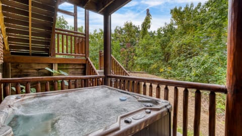 Relax in the bubbling hot tub on the deck.
