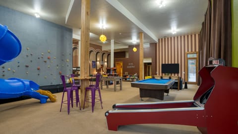 Outdoor hot tub on a deck surrounded by trees.