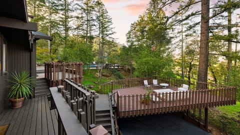 Unwind and enjoy forest views from the deck.