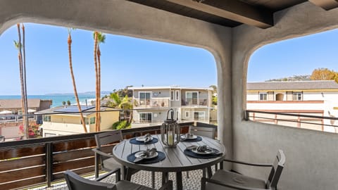 Enjoy outdoor meals on the balcony while enjoying panoramic ocean views.