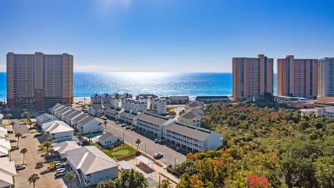 Aerial view showing the nearby beach and neighborhood.