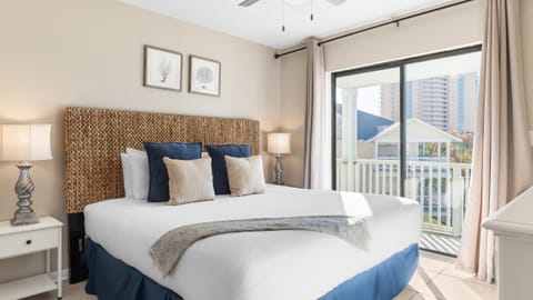 Primary bedroom features a king bed, TV, ceiling fan, and an ensuite bathroom.