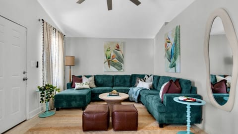 Modern living room with sectional sofa and television.