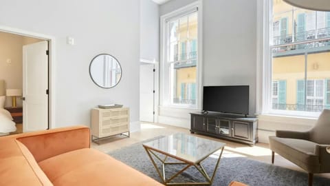 Living room with plush seating and a TV. (#401)