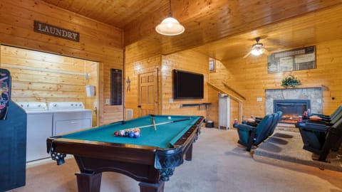Recreation area featuring a pool table and seating.