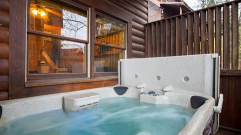 Outdoor hot tub on the deck, perfect for relaxing.