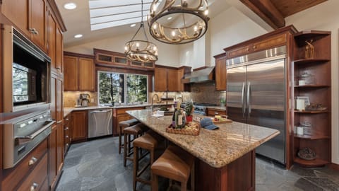 A chef-ready kitchen with granite counters, pro-grade appliances, and skylight views — perfect for cooking together after a day on the mountain.