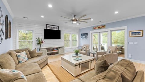 Bright and airy main living room with sectional sofa and coastal decor.