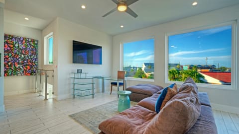 Bright and airy living room with open views and a TV to keep you entertained.