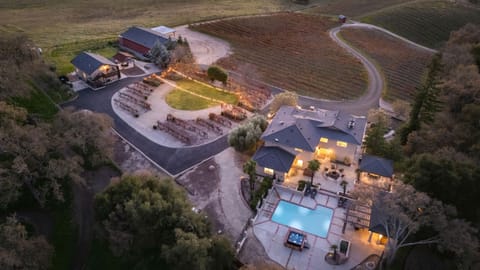 High-angle dusk shot of the entire gated property.