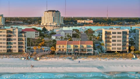 Aerial view of the beachfront property and surrounding coastline.