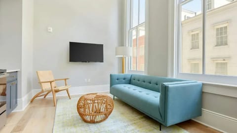 Living area with plush seating and a TV for entertainment.