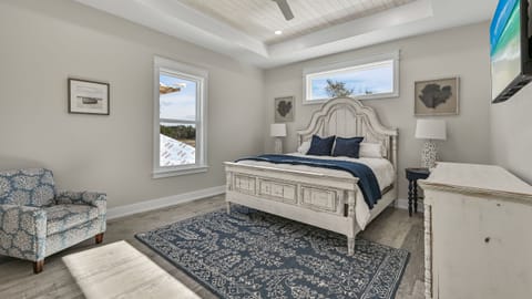 Bedroom 2 features a king-size bed, a TV, a ceiling fan, and an en-suite bathroom.