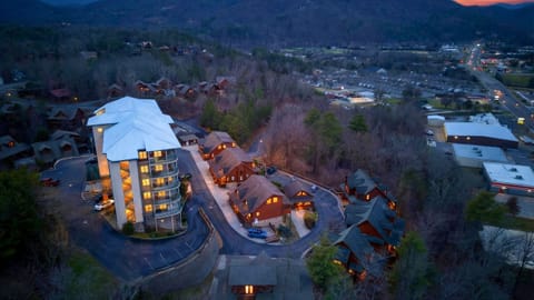 Aerial twilight view of the cabin resort nestled in the mountains.