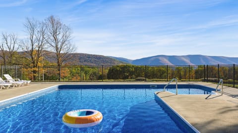 Take a refreshing dip in the pool while enjoying mountain views.