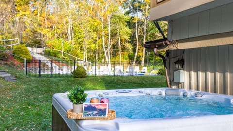 Relax in the bubbling hot tub surrounded by forest.