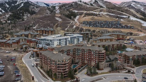 Aerial wide shot of the property nestled in the mountain valley.
