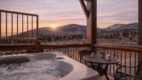 Private balcony hot tub with sweeping mountain views—perfect for après-ski soaks or sunset relaxation.