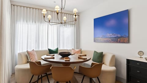 Charming mountain condo exterior set against a snowy alpine backdrop—your cozy Telluride home base.