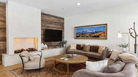 Bright, fully equipped kitchen with a spacious island and bar seating—perfect for cooking, gathering, and après-ski snacks.