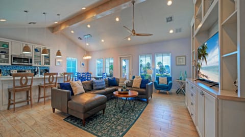 Spacious open-concept living room with coastal decor.