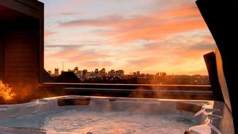 Soak in the rooftop hot tub as the Nashville skyline glows at sunset.