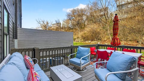 Private deck with lounge seating, fire pit, and outdoor dining.