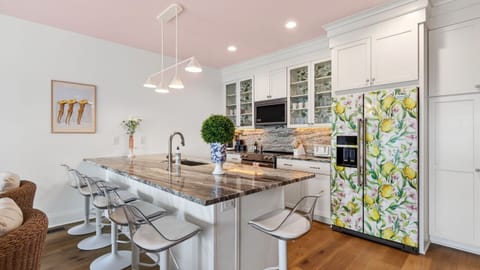 Fully equipped kitchen with island seating and standout design details.