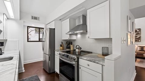 Fully equipped kitchen with stainless steel appliances.