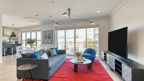 Living room off the balcony featuring a sleeper sofa.