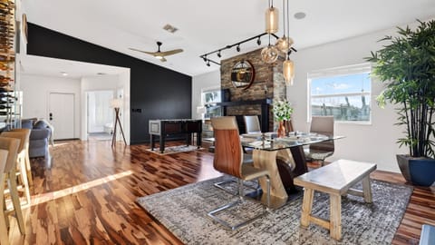 Spacious living and game area with foosball, fireplace, and seating.