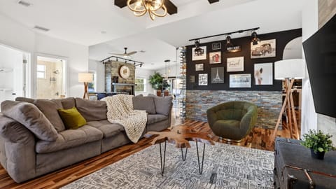 Inviting open-concept living space with cozy seating and curated decor.
