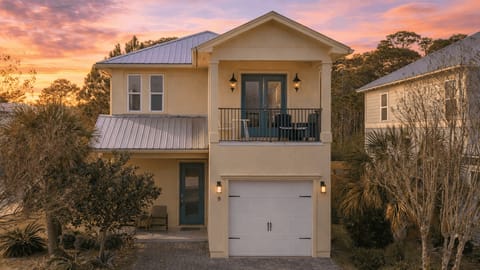 Bright coastal home with a private balcony, driveway parking, and charming curb appeal—your Destin stay starts here.