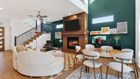 Sleek, modern kitchen with a spacious island, stainless steel appliances, and bar seating for casual meals.