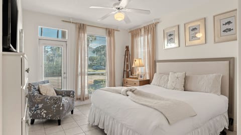 The primary bedroom, located on the first floor, features a king bed, TV and an ensuite bathroom.