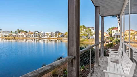 Peaceful porch seating with serene lake views—perfect for morning coffee, sunset chats, and soaking up the coastal calm.