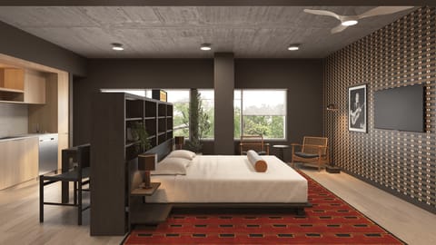 Modern resident lounge/media room with plush seating and a minimalist entertainment setup.