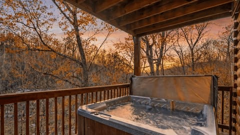 Relax in the private hot tub on the deck while enjoying a golden sunset over the mountains.
